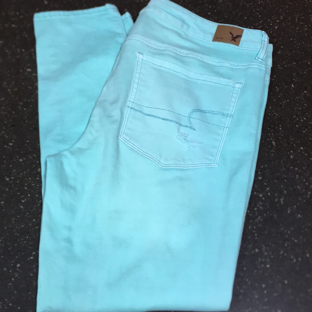 American Eagle mint green distressed stretch jeans